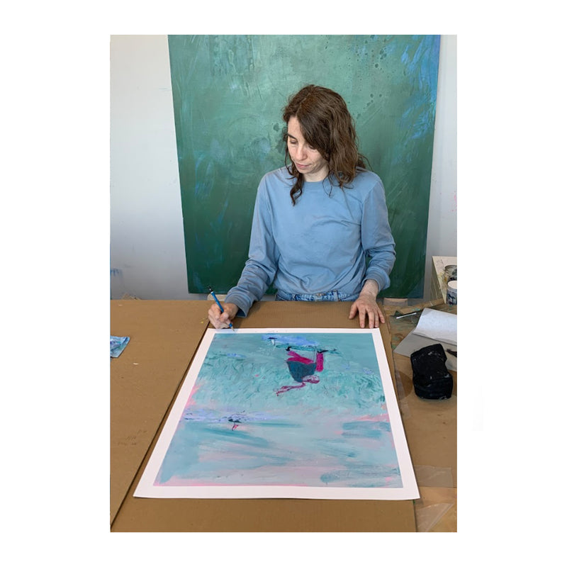 Alissa McKendrick signing her print, Untitled, in her studio